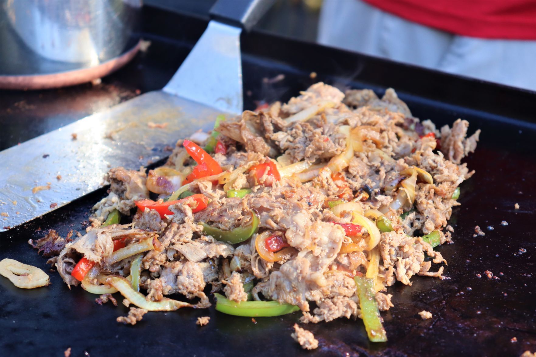 Blake Sykora preparing a Wisconsin cheese steak
